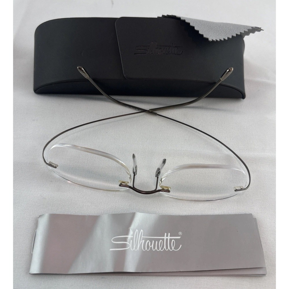Silhouette Eyeglasses 7799 40 6102 Titan Rimless Frame Austria 49[]19 150 w/Case